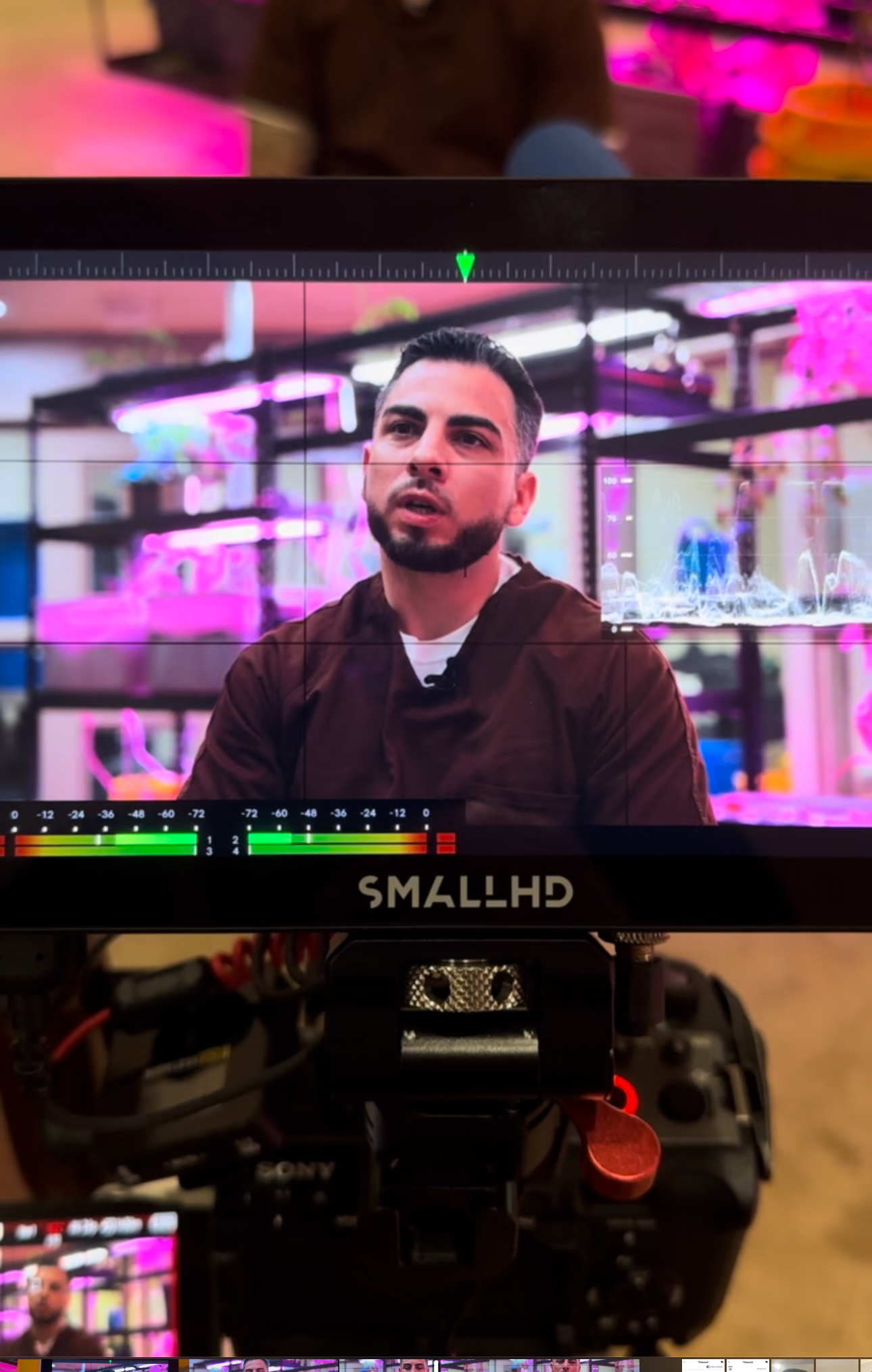 Behind the scenes documentary filming through camera lens