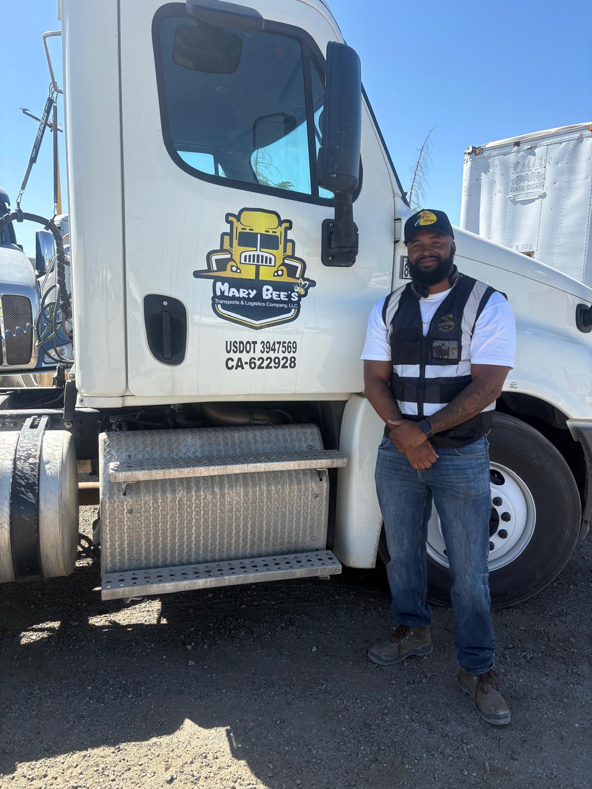 Kwante W. standing next to his box truck