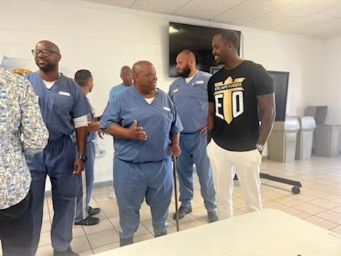 Aaron connecting with individuals at a correctional facility