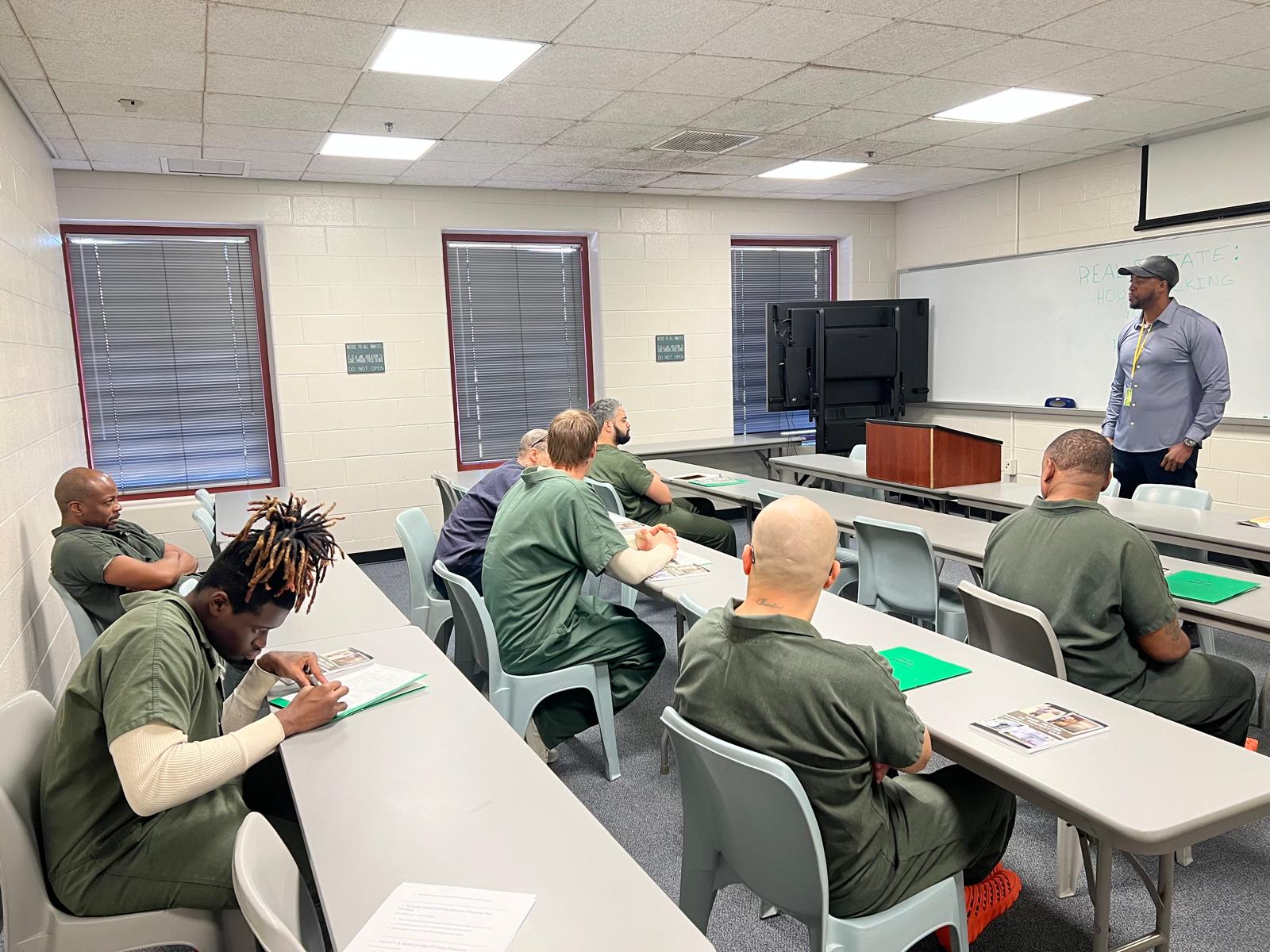 Participants with workbooks and certificates